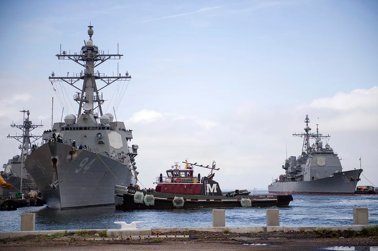 In this Monday, Sept. 10, 2018, photo released by the U.S. Navy, the guided-missile destroyer USS Nitze departs Naval Station Norfolk after the announcement of Hurricane Florence, in Norfolk, Va. In this Monday, Sept. 10, 2018, photo released by the U.S. Navy, the guided-missile destroyer USS Nitze departs Naval Station Norfolk after the announcement of Hurricane Florence, in Norfolk, Va.