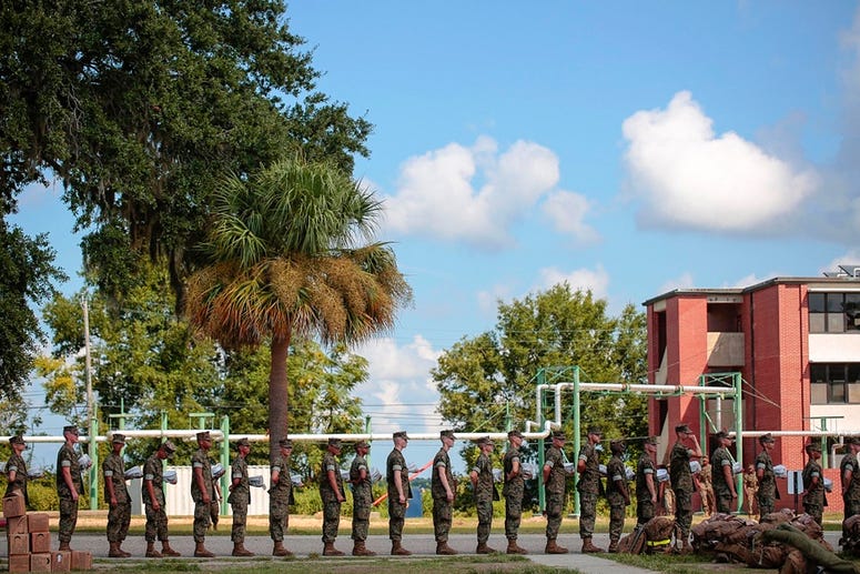 In this photo released by the U.S. Marine Corps, recruits at Marine Corps Recruit Depot Parris Island prepare to evacuate following an evacuation order directed by Brig. Gen. James Glynn, the depot's commanding general ahead of hurricane Florence. All Mar In this photo released by the U.S. Marine Corps, recruits at Marine Corps Recruit Depot Parris Island prepare to evacuate following an evacuation order directed by Brig. Gen. James Glynn, the depot's commanding general ahead of hurricane Florence. All Mar
