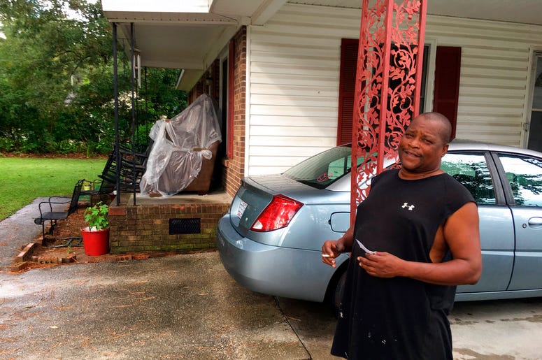 James Howell Jr. sizes up how to protect his home Tuesday, Sept. 11, 2018, in Princeville, N. C., from the approaching Hurricane Florence. The house was damaged by Hurricane Matthew in 2016. Howell said the furniture on his porch is there because he had t James Howell Jr. sizes up how to protect his home Tuesday, Sept. 11, 2018, in Princeville, N. C., from the approaching Hurricane Florence. The house was damaged by Hurricane Matthew in 2016. Howell said the furniture on his porch is there because he had t