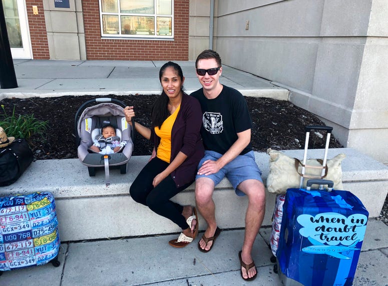 Colin and Louilyn Richards and their newborn daughter prepare to leave Norfolk, Va. on Wednesday, Sept. 12, 2018, as Hurricane Florence approaches the East Coast. Colin Richards is a U.S. Navy diver based in Virginia Beach. He's among the military personn Colin and Louilyn Richards and their newborn daughter prepare to leave Norfolk, Va. on Wednesday, Sept. 12, 2018, as Hurricane Florence approaches the East Coast. Colin Richards is a U.S. Navy diver based in Virginia Beach. He's among the military personn