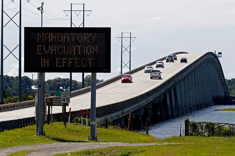 A sign posts a mandatory evacuation prior to Hurricane Florence in Emerald Isle N.C., Wednesday, Sept. 12, 2018. A sign posts a mandatory evacuation prior to Hurricane Florence in Emerald Isle N.C., Wednesday, Sept. 12, 2018.