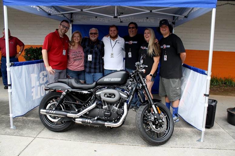 The Wolf's Smokin' Harley winner with The Wolf airstaff The Wolf's Smokin' Harley winner with The Wolf airstaff
