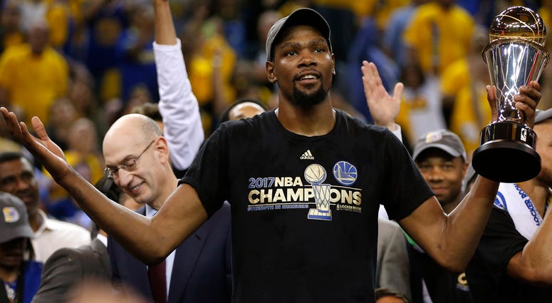 Kevin Durant The Golden State Warriors' Kevin Durant holds the Finals MVP trophy after defeating the Cleveland Cavaliers, 129-120, in Game 5 of the NBA Finals at Oracle Arena in Oakland, Calif., on Monday, June 12, 2017.