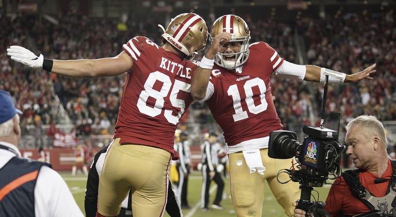George Kittle and Jimmy Garoppolo celebrate win