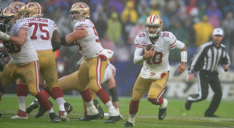 The rain pours down on Jimmy Garoppolo in Baltimore