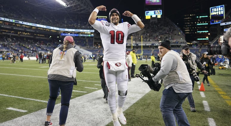 Jimmy Garoppolo celebrates 49ers' NFC West clinching win