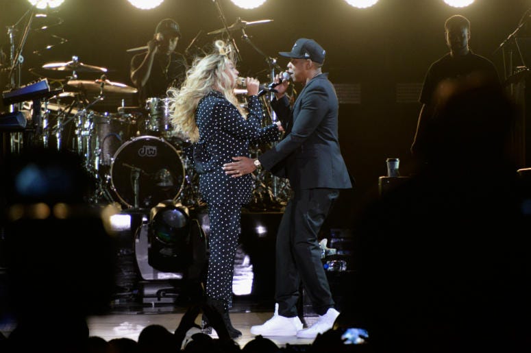 Beyonce & Jay-Z Beyonce and Jay Z perform on stage during a Get Out The Vote concert in support of Hillary Clinton at Wolstein Center on November 4, 2016 in Cleveland, Ohio. With less than a week to go until election day.