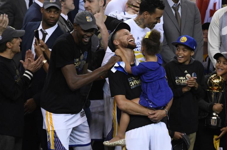 Golden State Warriors forward Kevin Durant (35) and guard Stephen Curry (30) celebrate after winning the 2017 NBA Finals. Golden State Warriors forward Kevin Durant (35) and guard Stephen Curry (30) celebrate after game five of the 2017 NBA Finals against the Cleveland Cavaliers at Oracle Arena.
