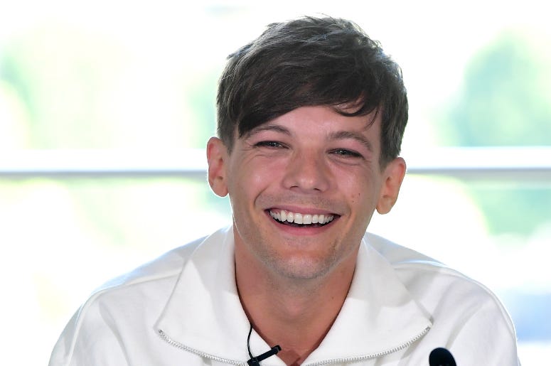 Louis Tomlinson attending the X Factor photocall Louis Tomlinson attending the X Factor photocall