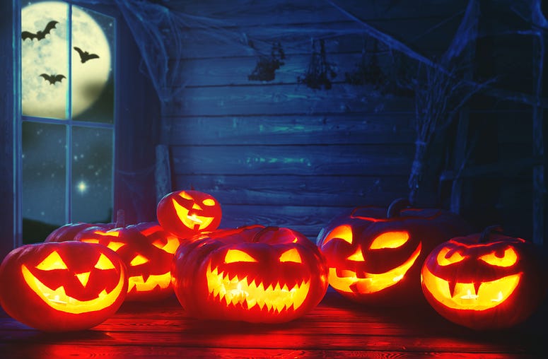 Spooky halloween background. scary pumpkin with burning eyes Spooky halloween background. scary pumpkin with burning eyes