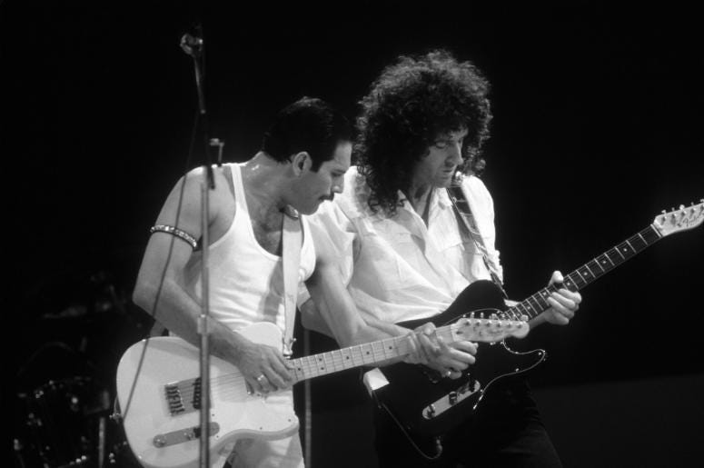 Queen members Freddie Mercury (left) and Brian May (right) during the Live Aid concert Queen members Freddie Mercury (left) and Brian May (right) during the Live Aid concert