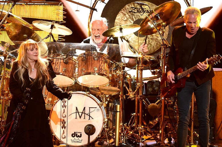 Stevie Nicks, Mick Fleetwood, and Lindsey Buckingham of Fleetwood Mac appear at the 2018 MusiCares Person of the Year Stevie Nicks, Mick Fleetwood, and Lindsey Buckingham of Fleetwood Mac appear at the 2018 MusiCares Person of the Year