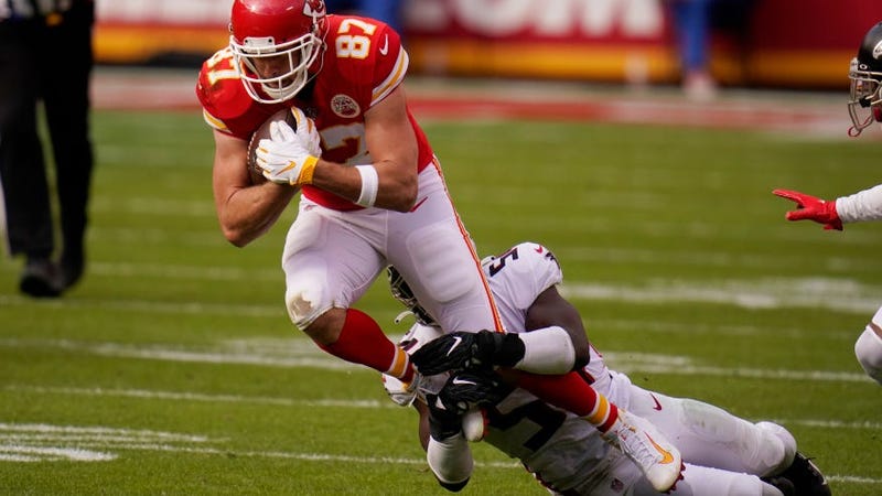 Kansas City Chiefs tight end Travis Kelce is tackled by Atlanta Falcons Foyesade Oluokun during the first half of an NFL football game, Sunday, Dec. 27, 2020, in Kansas City.