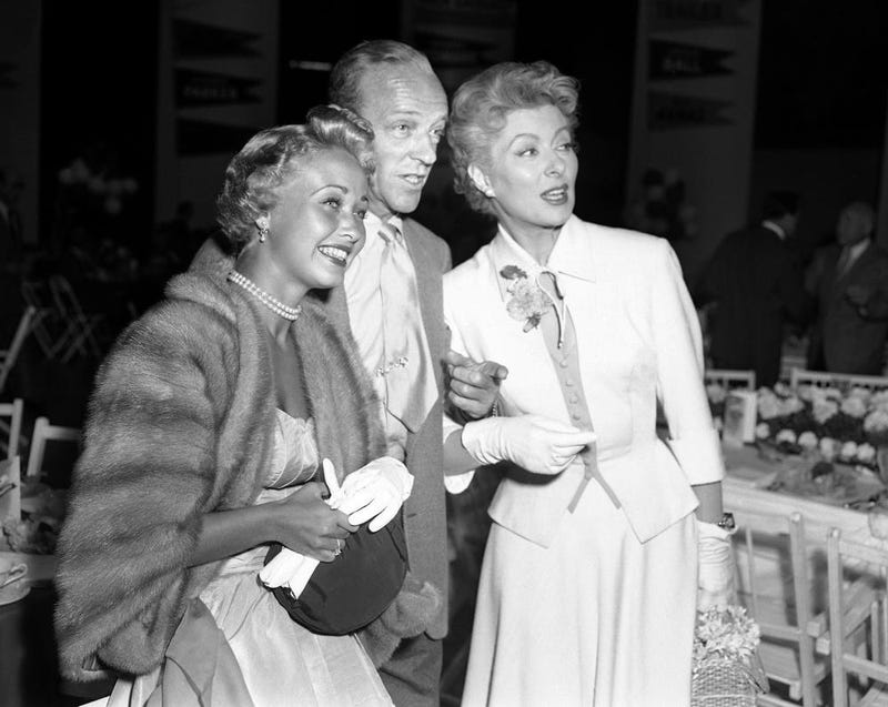 Powell, left, Fred Astaire, center and Greer Garson pose for a photo in Los Angeles in 1953. (AP Photo/Ellis Bosworth)