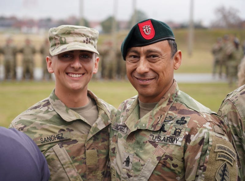 Command Sgt. Maj. Terry M. Sanchez (right), command sergeant major of the 7th Special Forces Group (Airborne), and Pvt. Diego Sanchez (left) pause for a photo during the graduation ceremony at the U.S. Army Airborne School