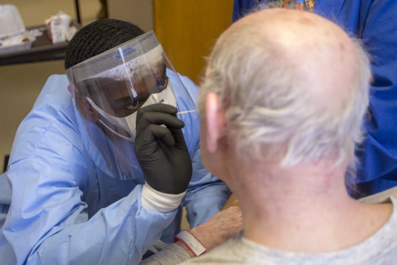 U.S. Army Pfc. Alandes T. Rowsey, a combat medic specialist assigned to the 223rd Engineer Battalion, Mississippi National Guard, administers a COVID-19 test at the Mississippi State Veterans Home in Kosciusko, Miss., May 15, 2020.