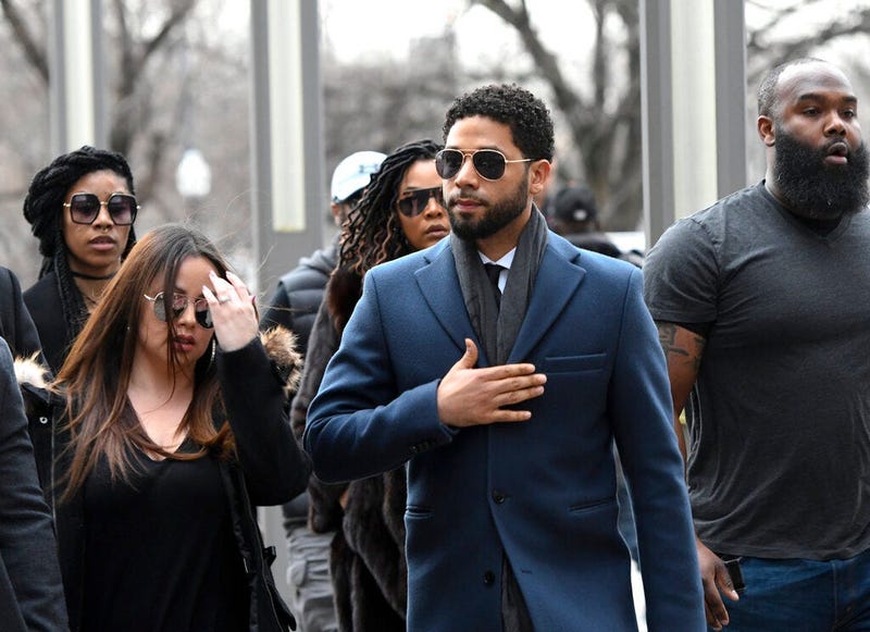 Empire actor Jussie Smollett, center, arrives at the Leighton Criminal Court Building for his hearing on Thursday, March 14, 2019, in Chicago.