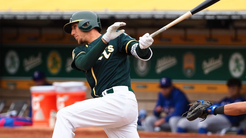 Apr 5, 2018; Oakland, CA, USA; Oakland Athletics right fielder Stephen Piscotty (25) hits a single against the Texas Rangers during the sixth inning at Oakland Coliseum. Mandatory Credit: Kelley L Cox-USA TODAY Sports