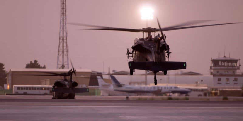 Two Army UH-60 Black Hawk helicopters land, Sept. 7, 2008. Black hawks equipped for medical evacuation travel without armament, using "flares and courage" to carry out their mission.