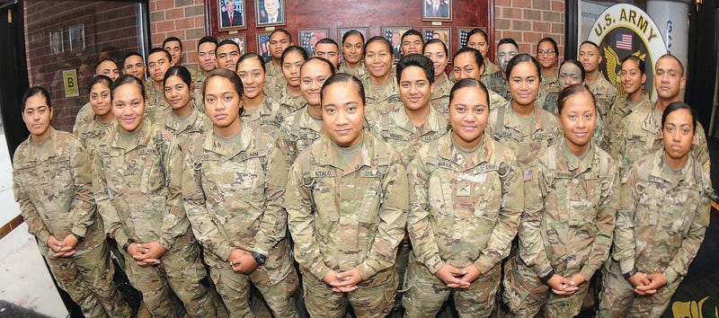More than 30 members of an American Samoa family pose for pictures at Thompson Hall, Fort Lee, Va.