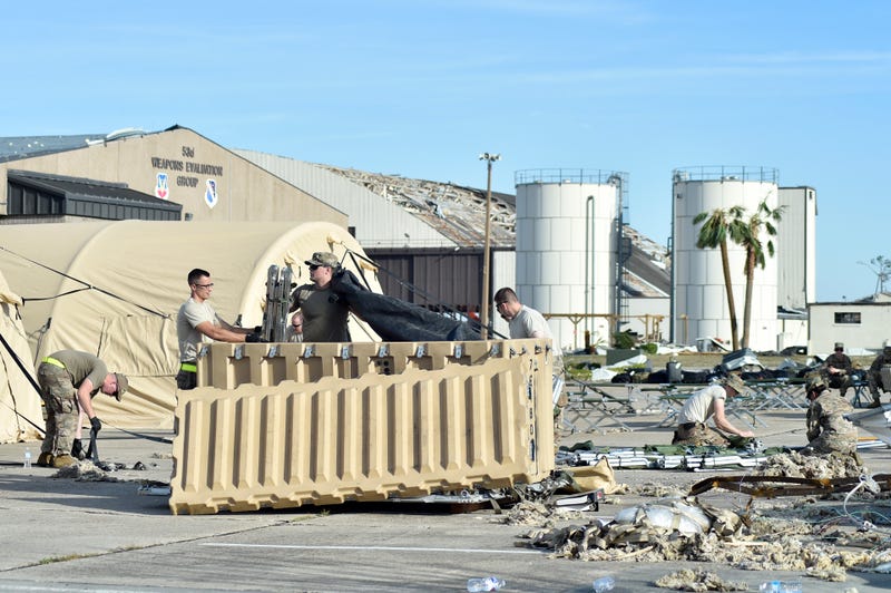 Airmen from the 821st Contingency Response Group set up tent city at Tyndall Air Force Base, Florida, Oct. 12, 2018. The contingency response team deployed to assess damage and establish conditions for the re-initiation of airflow, bringing much needed equipment, supplies and personnel for the rebuilding of the base in the aftermath of Hurricane Michael. Air Mobility Command equipment and personnel stand by across the nation to provide even more support upon request. (U.S. Air Force photo by Tech. Sgt. Liliana Moreno)