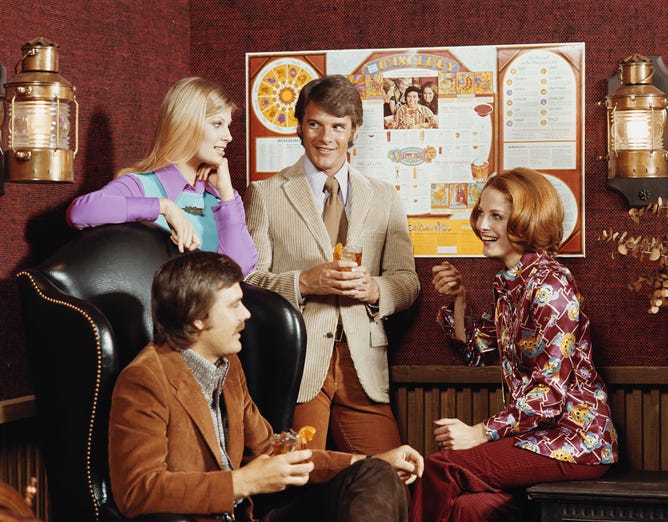 Hip folks attend party in 1972, lots of polyester!