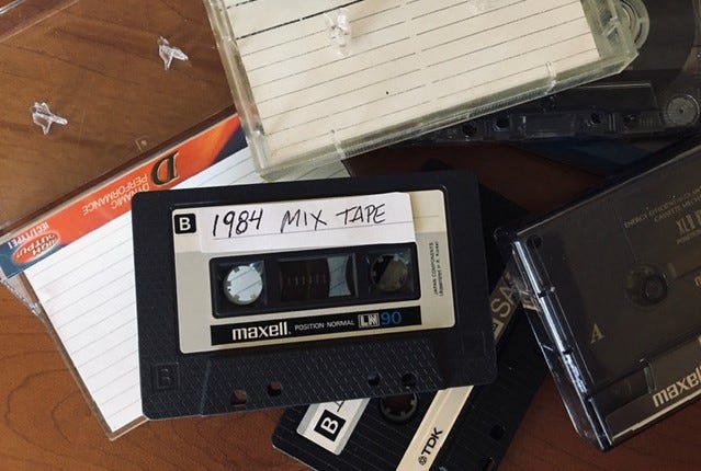 Pile of cassettes, including 1984 mix tape
