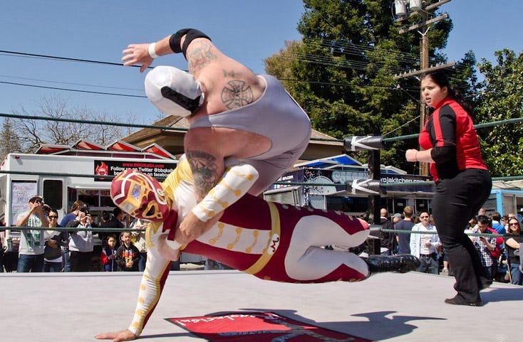Lucha Libre masked-wrestlers at the Taco Festival of Innovation