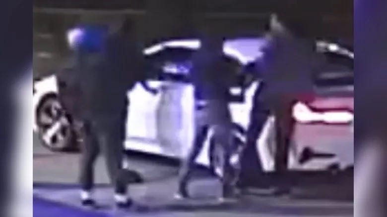 Surveillance video shows a carjacking at the Sunoco station at 5901 Wissahickon Ave. in Philadelphia.