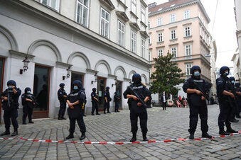 Police officers guard the scene in Vienna, Austria, Tuesday, Nov. 3, 2020. (AP Photo/Matthias Schrader)