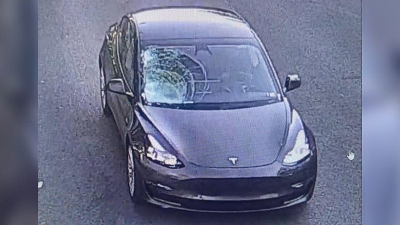 Tesla with window damage