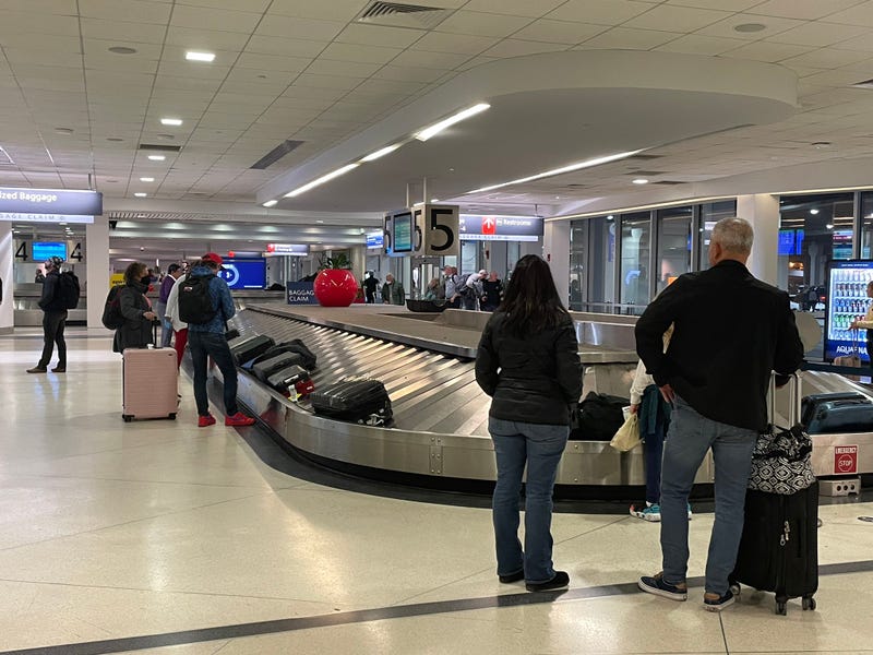 Travelers at Philadelphia International Airport.