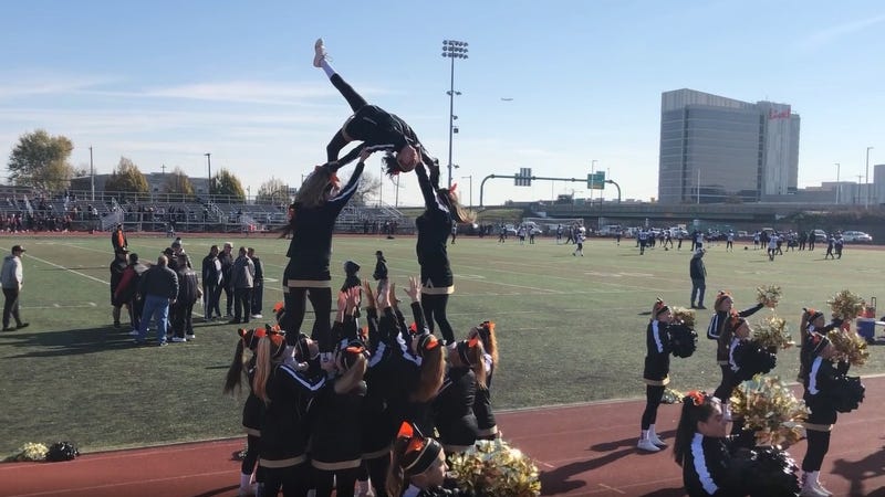 The Neumann-Goretti cheerleading squad warms up before the game against South Philadelphia High School.