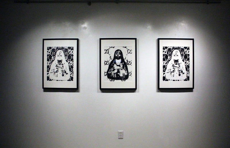 Three paintings of Gucci Mane at the TRAP CHAPEL pop-up art gallery in Atlanta
