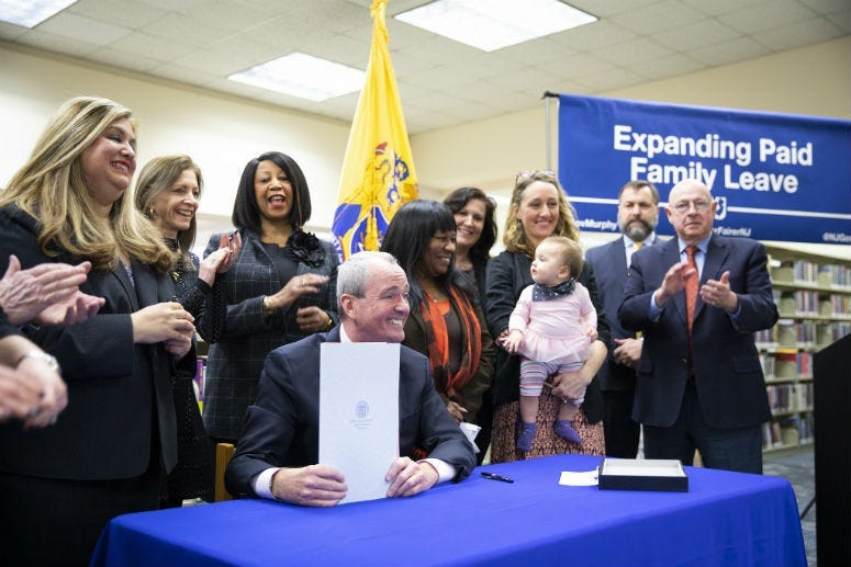 Governor Phil Murphy signs sweeping legislation to expand paid family leave on February 19, 2019, in Piscataway.