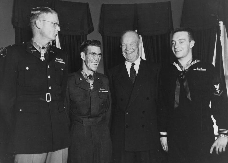 President Dwight D. Eisenhower poses with three men at White House in 1954 including Hospital Corpsman 3rd Class William Charette