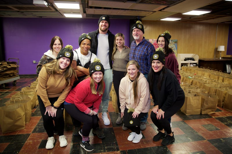 T.J. Watt and his wife with 412 Food Rescue staff