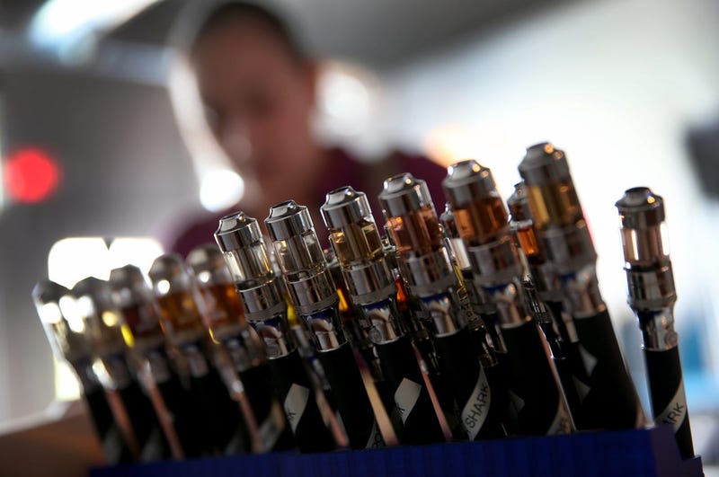 MIAMI, FL - FEBRUARY 20: Electronic cigarettes with different flavored E liquid are seen on display at the Vapor Shark store on February 20, 2014 in Miami, Florida. As the popularity of E- cigarettes continue to grow, leading U.S. tobacco companies such a