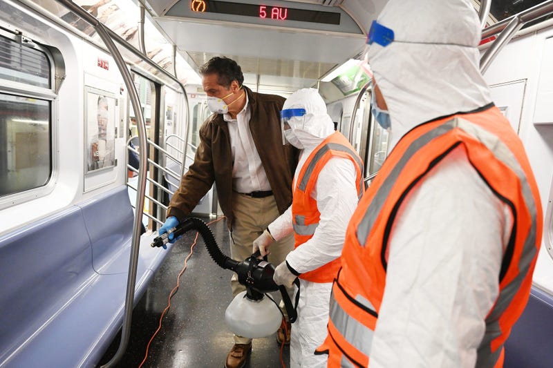 Cuomo disinfects a 7 train car in Queens