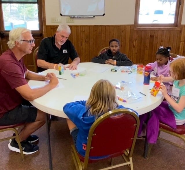 Picture of Dave O'Brien Participating In Children's Group Therapy Session