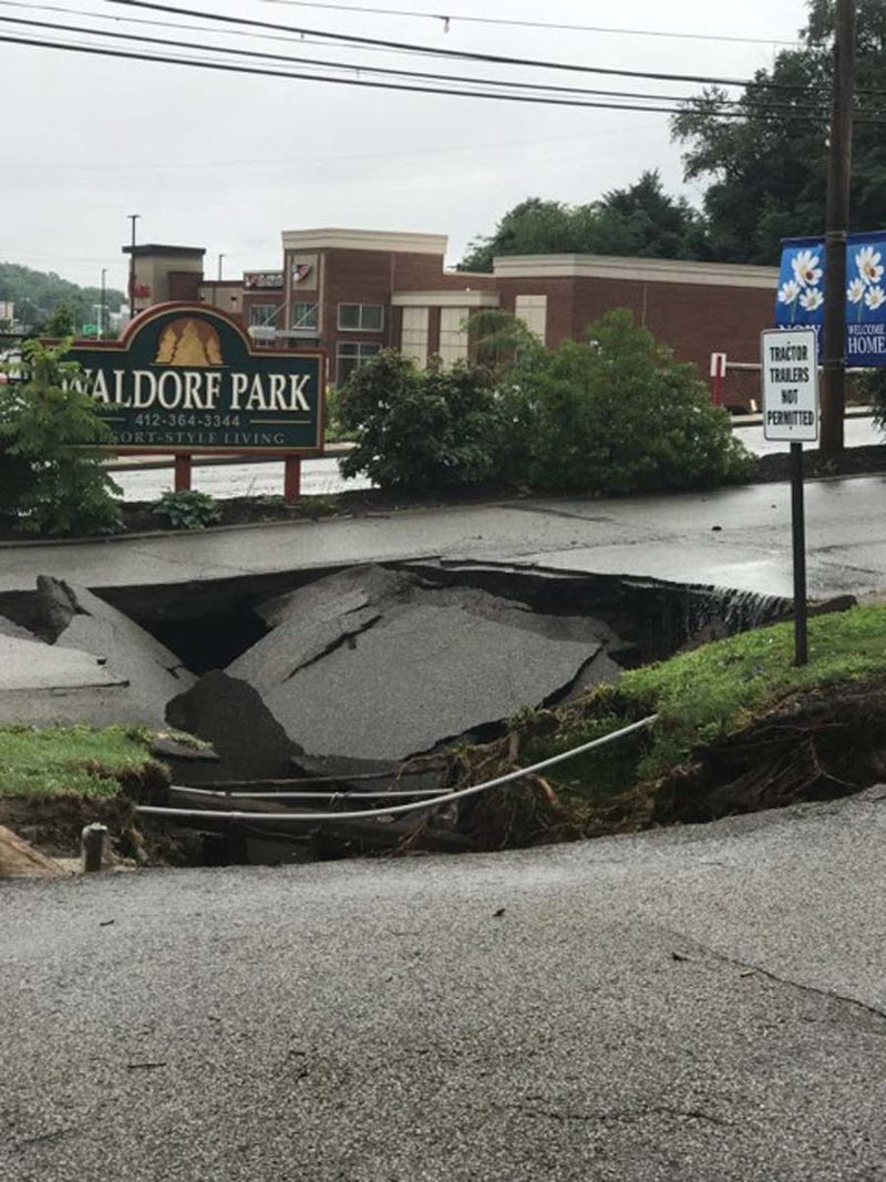 Heavy Rains Cause Sinkhole To Open Along McKnight Road