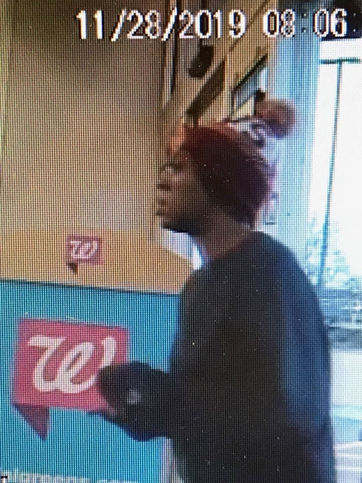 survellience video frame of woman in store