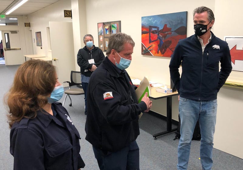 Gov. Gavin Newsom tours a mobile site in Alameda County on Friday vaccinating teachers and school staff.