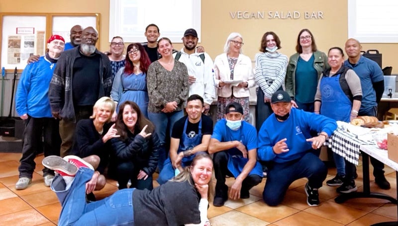 The staff of St. Vincent de Paul Society pose in the dining room.