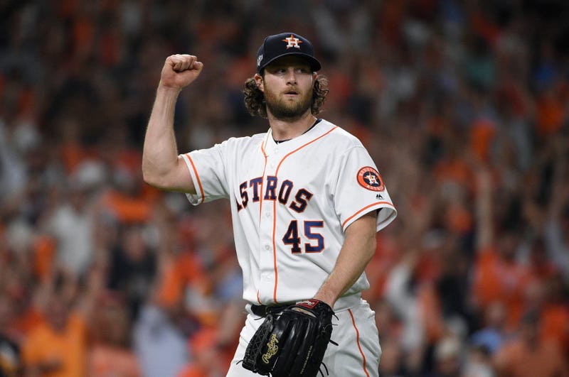 Houston Astros starting pitcher Gerrit Cole (45) reacts after an out against the Tampa Bay Rays during the seventh inning of Game 5 of a baseball American League Division Series in Houston,