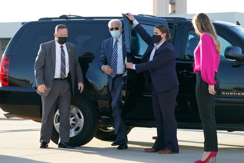 In this Oct. 18, 2020, photo, Democratic presidential candidate former Vice President Joe Biden steps out to board his campaign plane at Raleigh-Durham International Airport in Morrisville, N.C., en route to Wilmington, Del.
