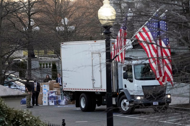 A van arrives to pick up boxes that were moved out of the Eisenhower Executive Office building, inside the White House complex, Thursday, Jan. 14, 2021, in Washington. Inauguration Day is also moving day at the White House.