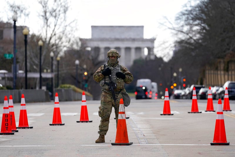 A National Guard stands at a road block near the Supreme Court ahead of President-elect Joe Biden's inauguration ceremony, Wednesday, Jan. 20, 2021, in Washington. (AP Photo/Gerald Herbert)