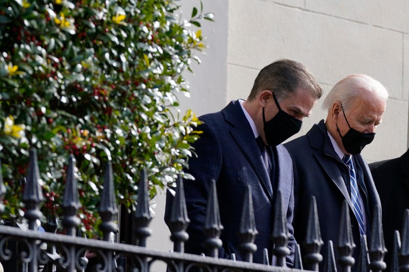President Joe Biden and his son Hunter depart after attending Mass at Holy Trinity Catholic Church, Sunday, Jan. 24, 2021, in the Georgetown neighborhood of Washington.