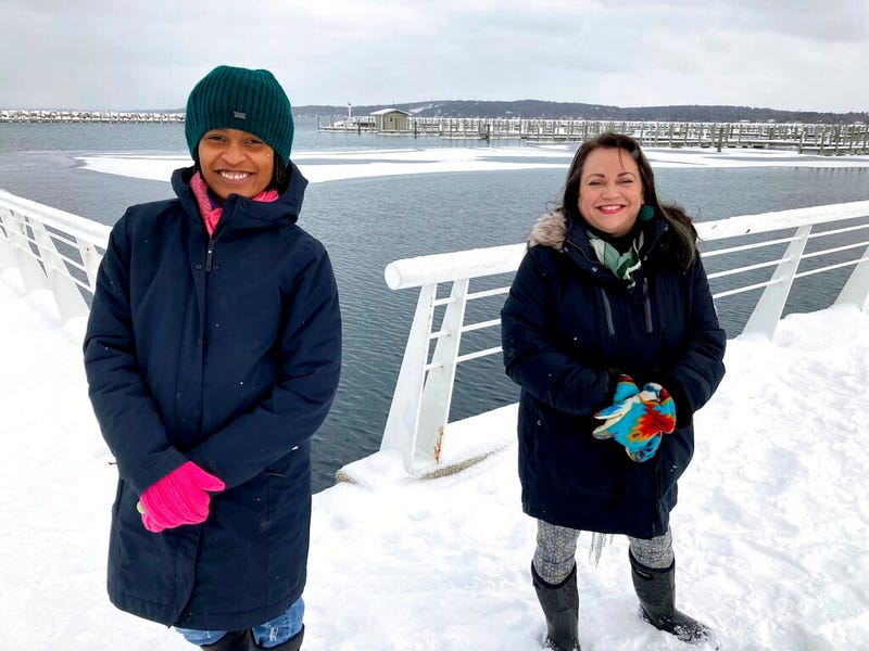 Activists Tyasha Harrison, left, and Holly T. Bird pose along the Grand Traverse Bay waterfront in Traverse City, Mich., Feb. 13, 2021.